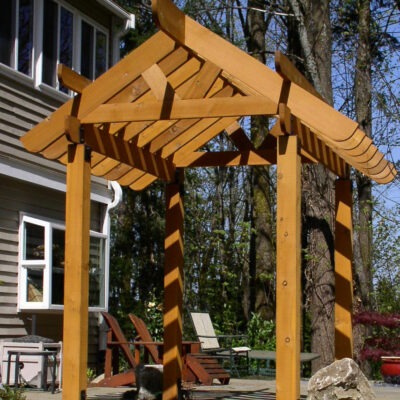 Builders of custom wood structures such as this Japanese style pagoda set atop of a paved patio in a residence in Seattle, Washington.
