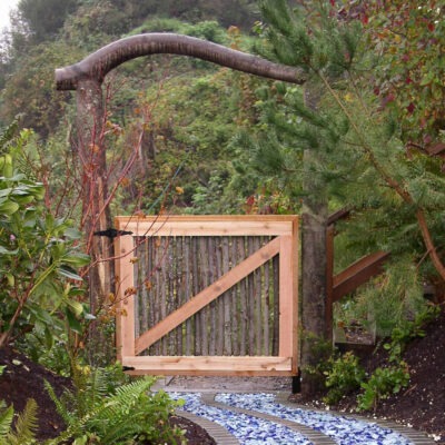 Unique and contemporary garden gate leads to a mediation garden in Seattle residence created by Bonney Lake Landscapes.