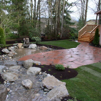 Water feature in backyard installation landscaping